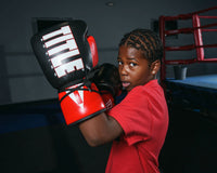 variant:Black/Red/White::TITLE Boxing Pro Style Youth Lace Training Gloves boy throwing uppercut