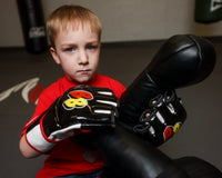 variant:black/white/red::BOOM BOOM Boxing Bomber Youth MMA Glove kid putting on gloves