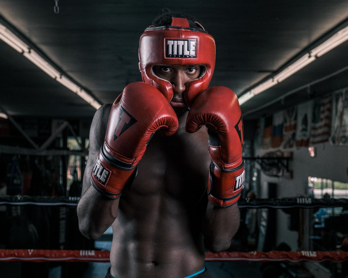 variant:lifestyle::TITLE Boxing Blood Red Leather Sparring Headgear guy in boxing stance