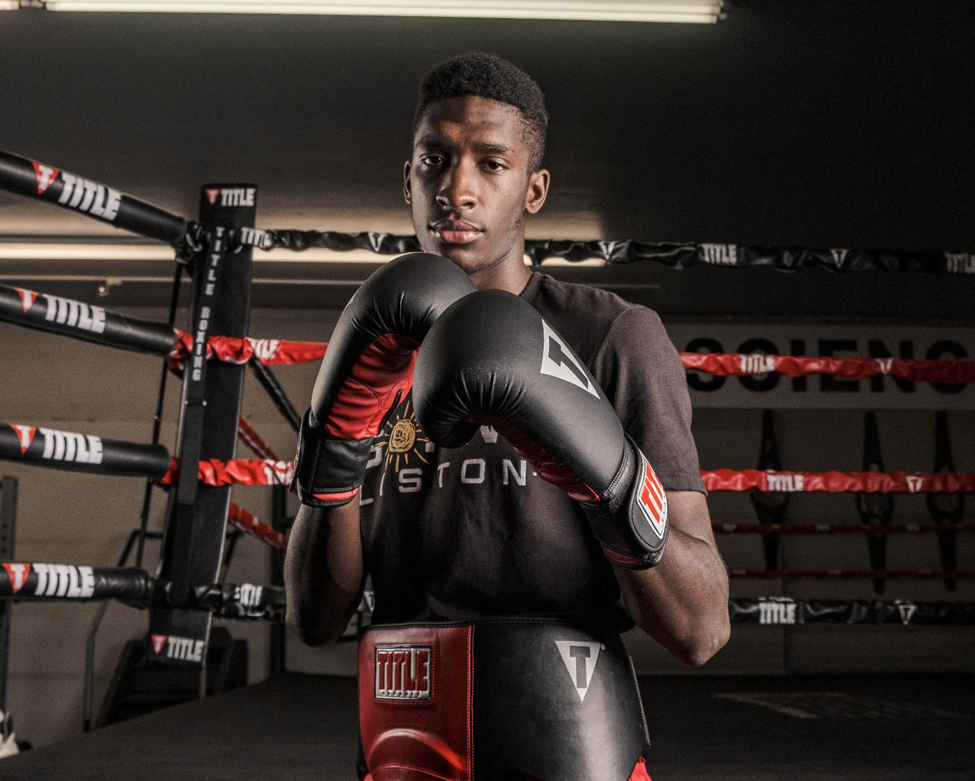 variant:black/red::TITLE Classic Fitness Boxing Gloves guy wearing gloves in ring