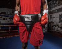 variant:lifestyle::TITLE Boxing Deluxe Groin Protector Plus 2.0 on boxer red outfit