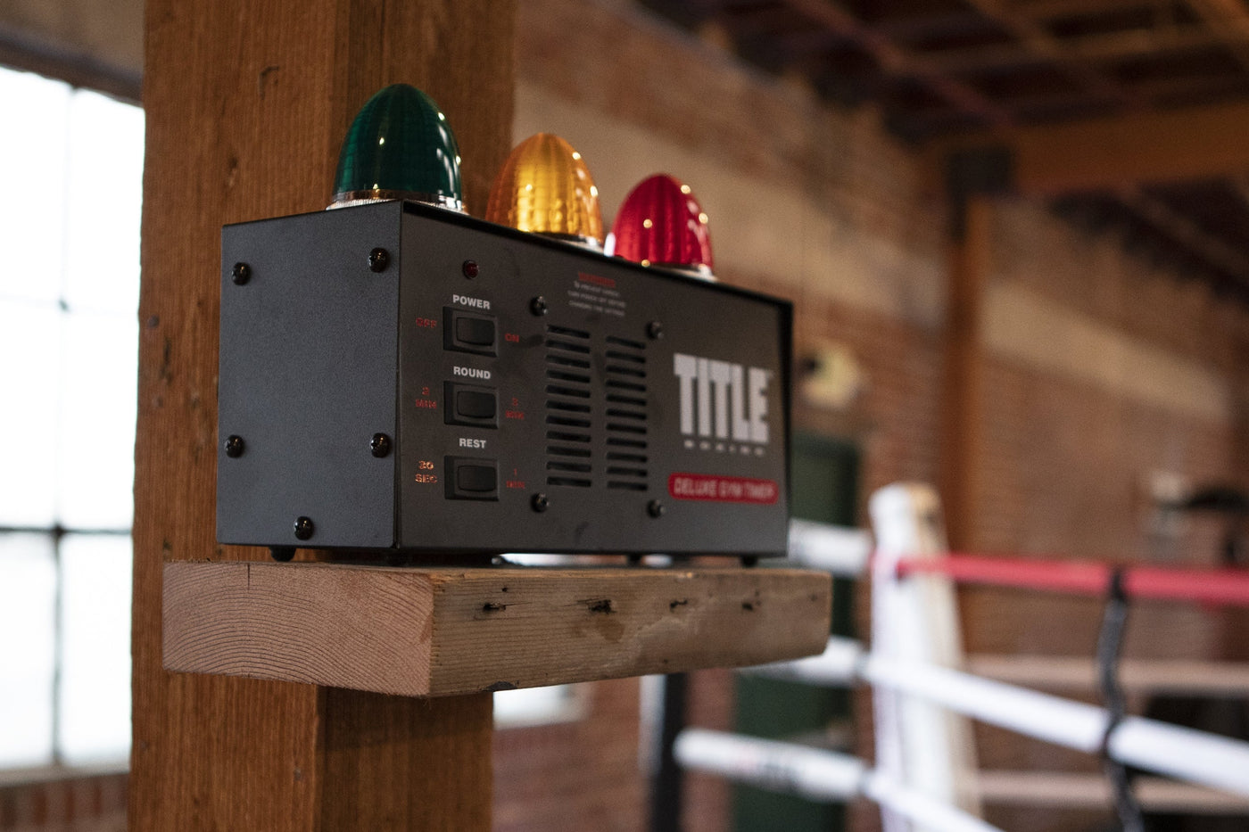 variant:lifestyle::TITLE Boxing Deluxe Gym Timer on a shelf at a boxing gym