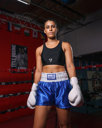 variant:black::TITLE Boxing Pro Compression Ascent Sports Bra girl in ring