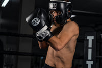 variant:Black::TITLE Boxing Leather Sparring Headgear man modeling headgear
