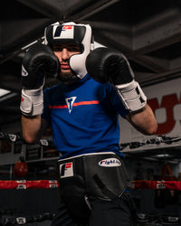 variant:Black::Fighting Pro Protective Cup man with hands up wearing cup