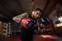 variant:Red/Black/White::TITLE Boxing Gel Lava Leather Series Training Gloves boxing pose