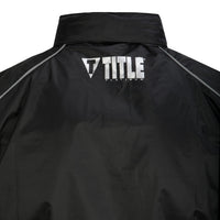 variant:lifestyle::TITLE Platinum Prevail Rubberized Sauna Suit main view hood off TITLE logo