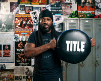 variant:lifestyle::TITLE Boxing Round Punch Shield coach holding up