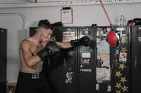 variant:lifestyle::TITLE boxing Rebounder Double End Bag guy hitting