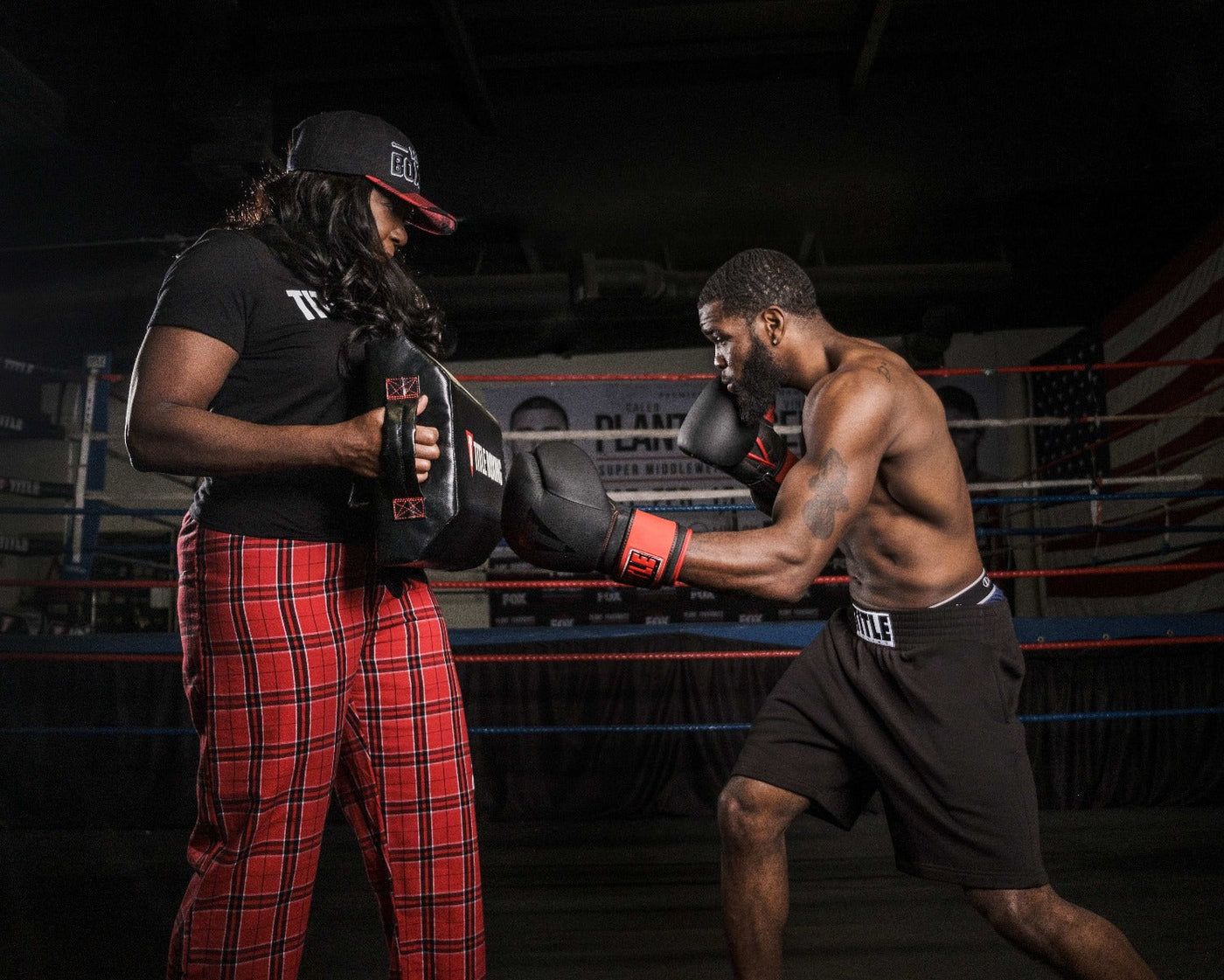 variant:lifestyle::TITLE Boxing Tombstone Training Shield guy hitting training shield 