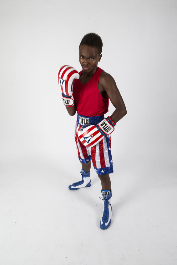 variant:Blue/White::TITLE Boxing Speed-Flex Encore High-Top Shoes boy posing in shoes