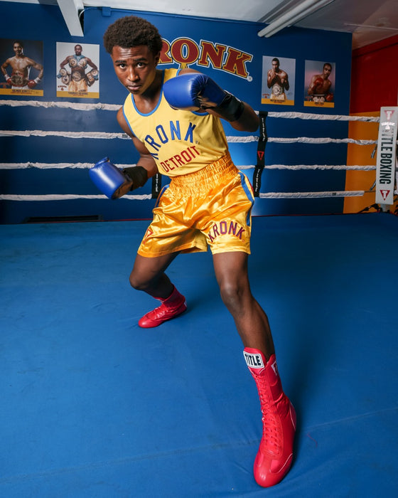 variant:Red::TITLE Boxing Speed-Flex Encore High-Top Shoes man posing in shoes