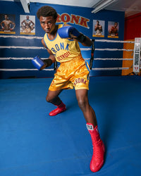 variant:Red::TITLE Boxing Speed-Flex Encore High-Top Shoes man posing in shoes