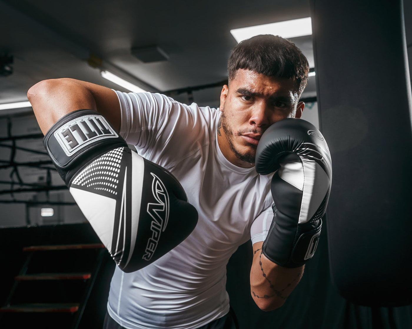 variant:Black/White::Viper by TITLE Boxing Strike Select Bag Gloves 2.0 man posing in gloves