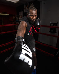 variant:Black/Silver::TITLE Boxing Leather Enforcer Pro Sparring Gloves man posing with gloves